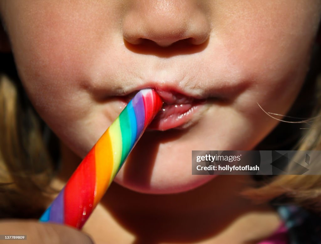 Girl with colorful lollipop