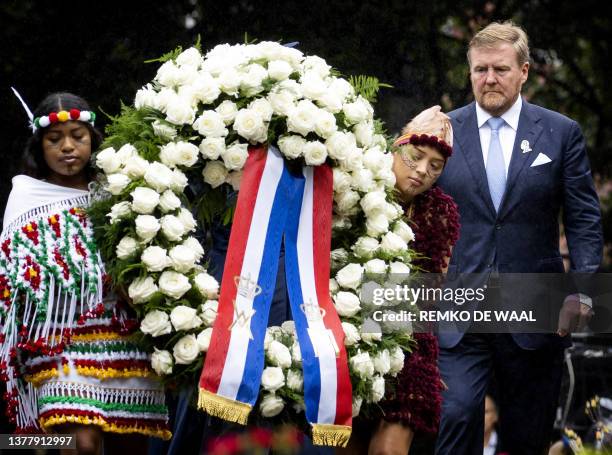 Netherlands' King Willem-Alexander lays a wreath during the National Remembrance Day of Slavery in The Oosterpark, Amsterdam on July 1, 2023. Dutch...