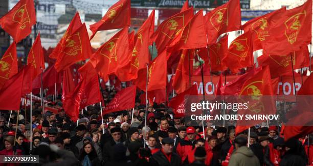 Russian communist party supporters carry red flags during a rally in Moscow on November 7 marking the 92th anniversary of Vladimir Lenin's overthrow...