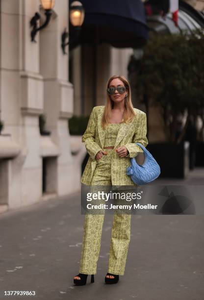 Sonia Lyson wearing Zara black plateau heels, Rotate yellow animal print blazer, crop top and matching Rotate pants via LuisaViaRoma, Attico grey...