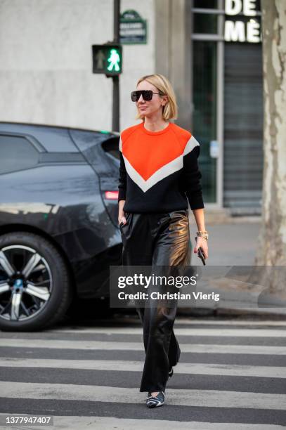 Lisa Aiken seen wearing striped orange white black blazer, leather pants, sunglasses outside Acne during Paris Fashion Week - Womenswear F/W...