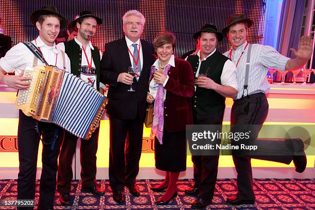 Bavarian Deputy Prime Minister Martin Zeil and DLD founder Steffi Czerny pose with bavarian musicians during the Burda DLD Nightcap 2011 at the...
