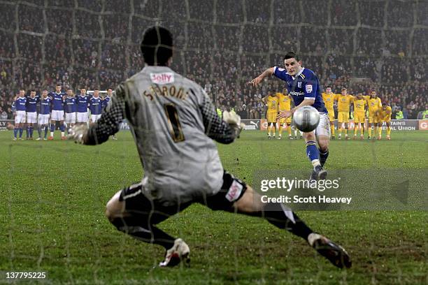 Craig Conway of Cardiff City of Cardiff City scores with his attempt in the penalty shootout during the Carling Cup Semi Final second leg match...