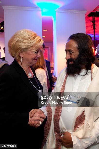 Liz Mohn and Ravi Shankar attend the Burda DLD Nightcap 2011 at the Steigenberger Bellvedere hotel on January 25, 2012 in Davos, Switzerland. DLD is...