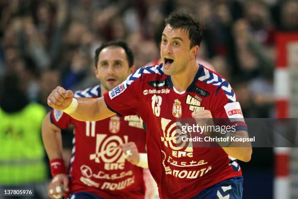 Momir Ilic of Serbia celebrates a goal during the Men's European Handball Championship second semi final match between Serbia and Croatia at...