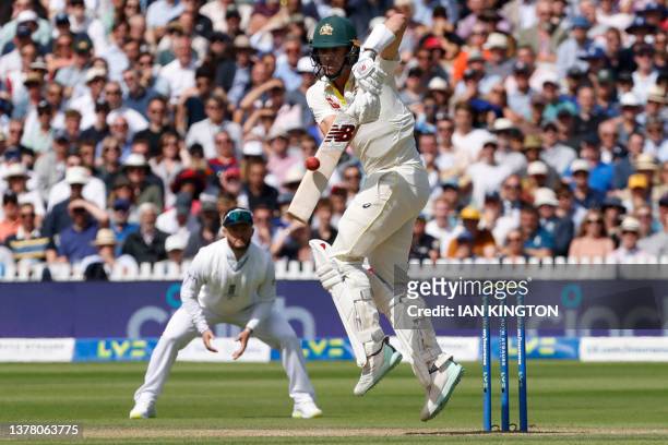 Australia's Pat Cummins plays a shot on day four of the second Ashes cricket Test match between England and Australia at Lord's cricket ground in...