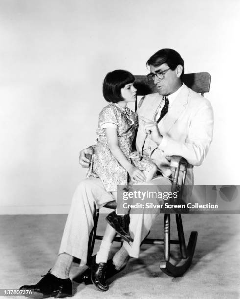 Actor Gregory Peck as Atticus Finch and Mary Badham as Jean Louise 'Scout' Finch in a publicity still for the film 'To Kill a Mockingbird', 1962.