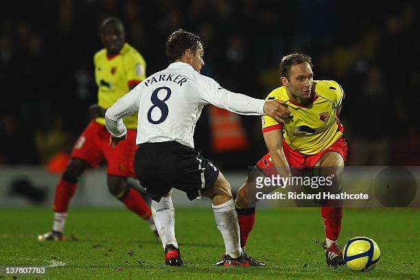 Scott Parker of Spurs and John Eustace of Watford fight for the ball during the FA Cup Fourth Round match between Watford and Tottenham Hotspur at...