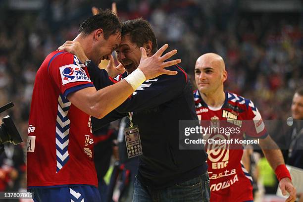 Momir Ilic of Serbia and head coach Veselin Vukovic of Serbia celebrate the 26-22 victory after the Men's European Handball Championship second semi...