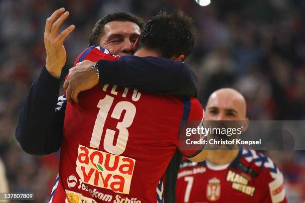 Momir Ilic of Serbia and head coach Veselin Vukovic of Serbia celebrate the 26-22 victory after the Men's European Handball Championship second semi...