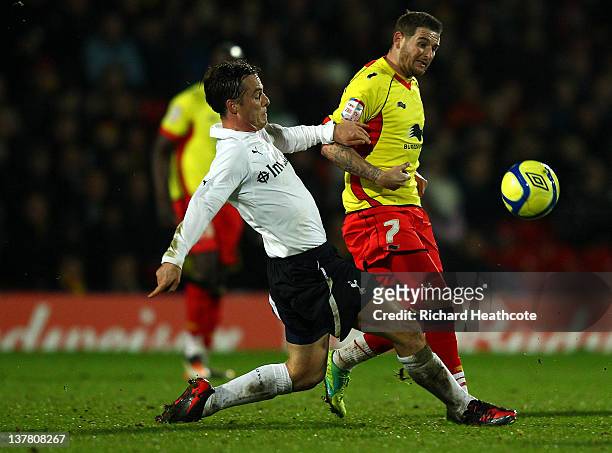 Scott Parker of Spurs tackles Mark Yeates of Watford during the FA Cup Fourth Round match between Watford and Tottenham Hotspur at Vicarage Road on...