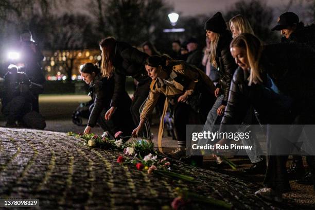 People lay flowers at the Clapham Common bandstand in memory of Sarah Everard on March 03, 2022 in London, England. One year since Sarah Everard went...