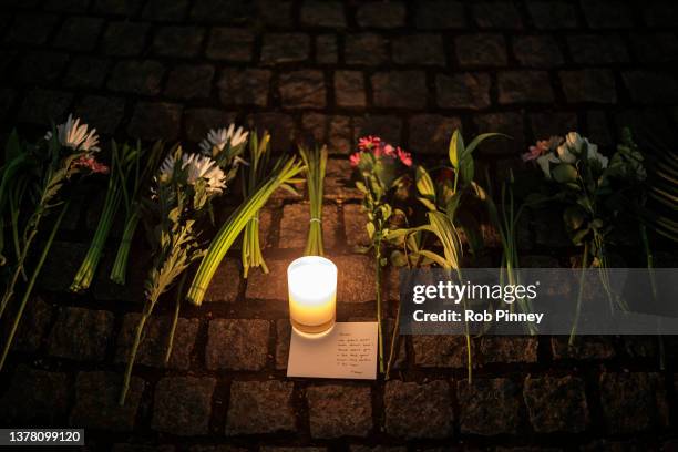 Candle and floral tributes are left at the Clapham Common bandstand in memory of Sarah Everard on March 03, 2022 in London, England. One year since...