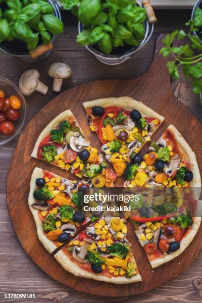 vegetarian pizza with broccoli, cherry tomato, pepper and mushrooms - vegetable pizza stock pictures, royalty-free photos & images