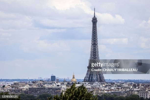 Photograph shows Paris' landmark Eiffel tower, as seen from Nanterre, outside Paris, on July 1, 2023.