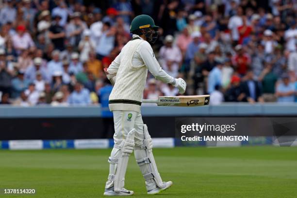 Australia's Nathan Lyon comes to the cease despite being unable to run due to an injury on day four of the second Ashes cricket Test match between...