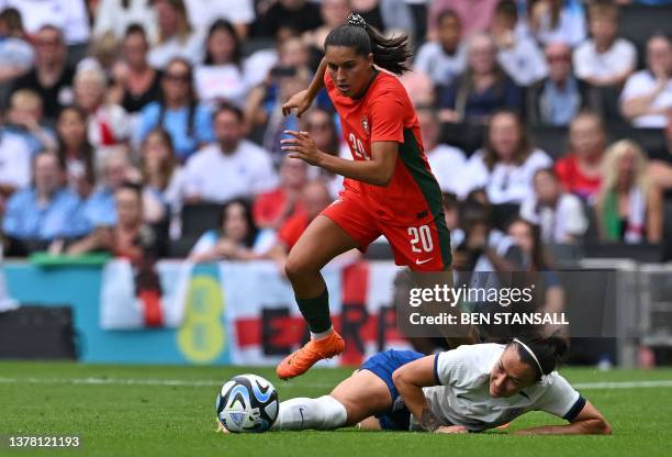 Portugal's striker Francisca Nazareth fouls England's defender Lucy Bronze during the International football friendly match between England and...