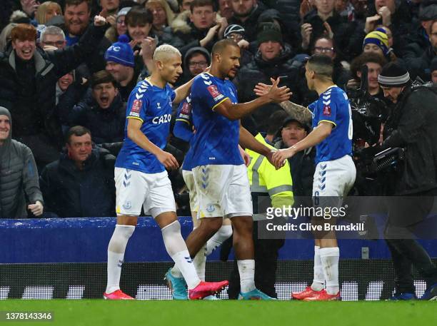 Jose Salomon Rondon of Everton celebrates with teammates Richarlison and Allan after scoring their team's first goal during the Emirates FA Cup Fifth...