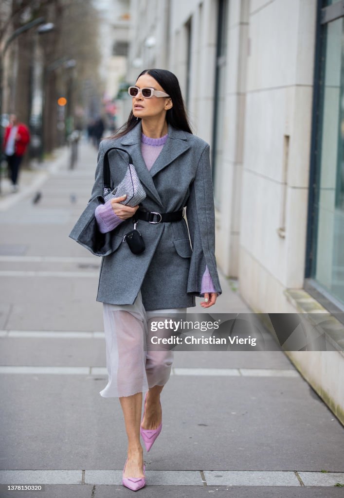 A guest is seen wearing grey blazer, silver Prada bag, sheer skirt, News  Photo - Getty Images