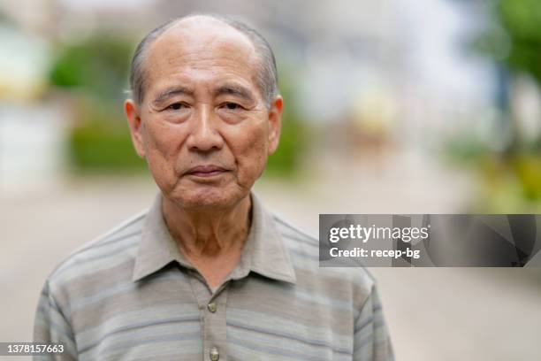 portrait of japanese senior man - serieus stock pictures, royalty-free photos & images