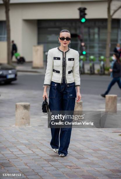 Mary Leest seen wearing dark denim jacket, black Chanel bag, latte creme white jacket outside Chloe during Paris Fashion Week - Womenswear F/W...