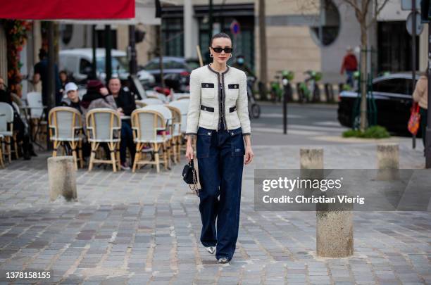 Mary Leest seen wearing dark denim jacket, black Chanel bag, latte creme white jacket outside Chloe during Paris Fashion Week - Womenswear F/W...