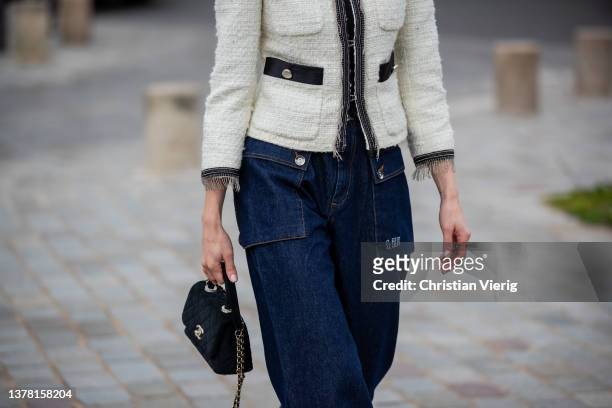 Mary Leest seen wearing dark denim jacket, black Chanel bag, latte creme white jacket outside Chloe during Paris Fashion Week - Womenswear F/W...