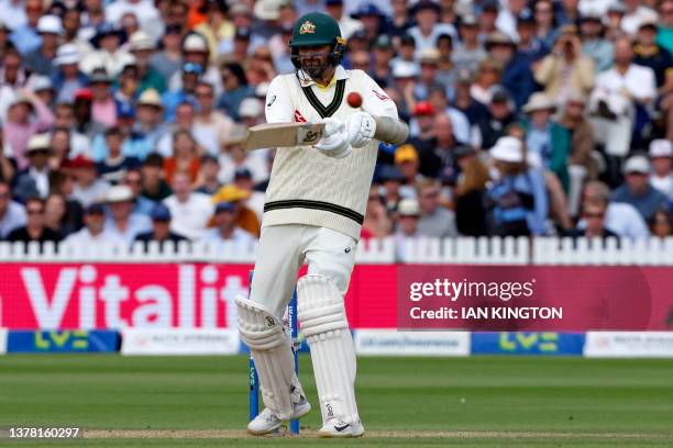 Australia's Nathan Lyon at the cease despite being unable to run due to an injury, hits a boundary on day four of the second Ashes cricket Test match...