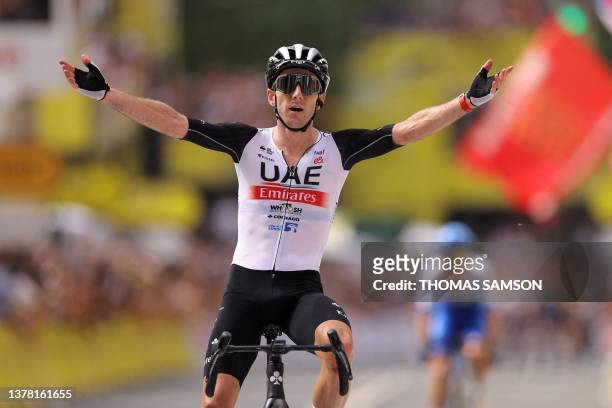 Team Emirates' British rider Adam Yates cycles to the finish line to win the 1st stage of the 110th edition of the Tour de France cycling race, 182...