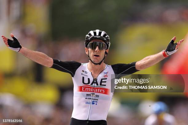 Team Emirates' British rider Adam Yates cycles to the finish line to win the 1st stage of the 110th edition of the Tour de France cycling race, 182...