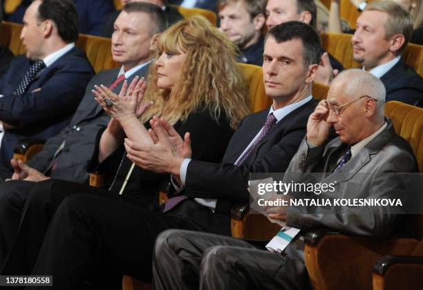 Russian billionaire, the leader of pro-reform Pravoye Delo party, Mikhail Prokhorov , and pop singer, Alla Pugacheva , take part at a congress of...