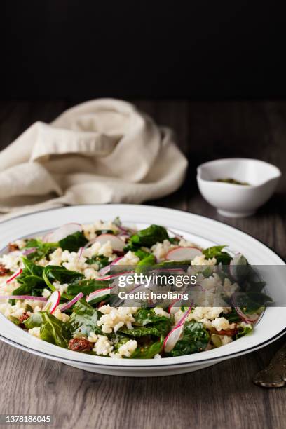 healthy vegan spring green, brown rice salad - brown rice stock pictures, royalty-free photos & images