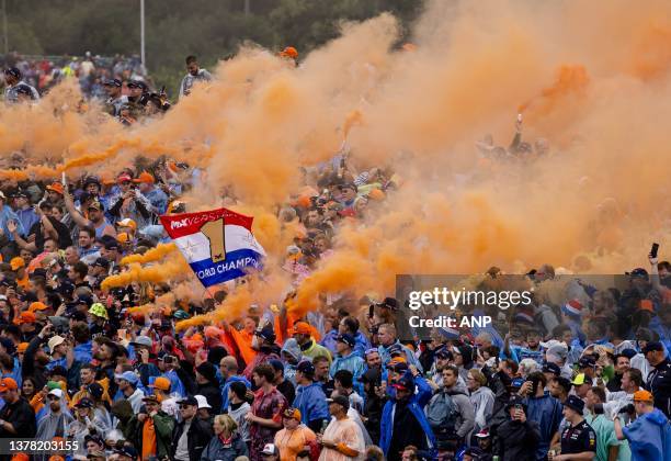 Dutch fans celebrate after Max Verstappen's win at the Sprint Race leading up to the Austrian Grand Prix at the Red Bull Ring on July 1, 2023 in...