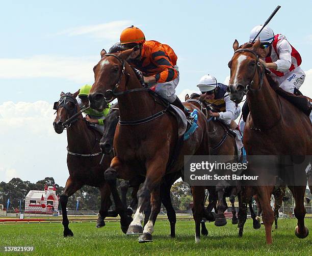 Jockey Peter Mertens rides Over Quota to win race 5 the Swettenham Stud Summer Championship Final during Greater Dandenong Raceday at Betfair Park on...