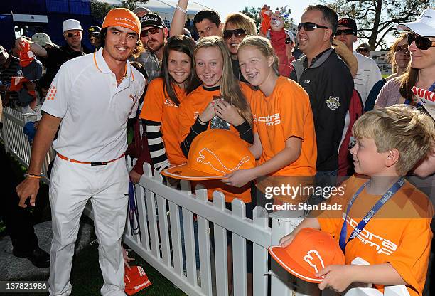 Rickie Fowler poses with fans after play during the second round of the Farmers Insurance Open at Torrey Pines, South Course Golf Course on January...