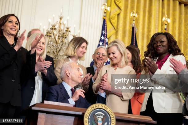 President Joe Biden hands a pen to former Fox News anchor Gretchen Carlson after signing the H.R. 4445, the “Ending Forced Arbitration of Sexual...
