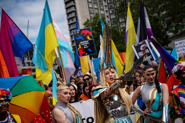 Participants with Ukrainian national flags march during The Pride in London Parade in London, UK, on Saturday, July 1, 2023. Pride flags are flying...