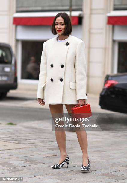 Tiffany Hsu is seen wearing a Chloe jacket, red bag and zebra shoes outside the Chloe show during Paris Fashion Week A/W 2022 on March 03, 2022 in...