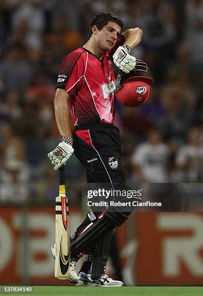 Moises Henriques of the Sydney Sixers walks from the ground after he was dismissed during the T20 Big Bash League Grand Final match between the Perth...