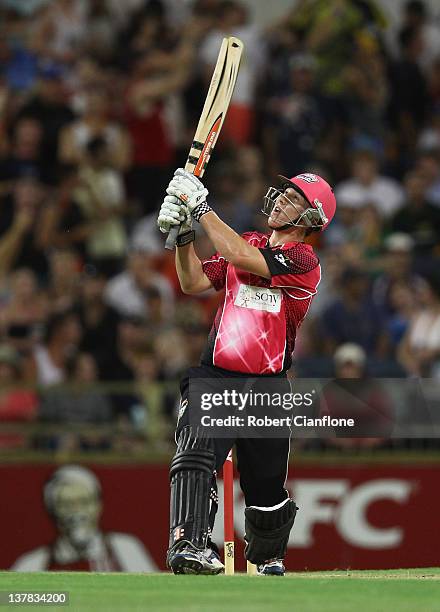 Nic Maddinson of the Sydney Sixers hits out during the T20 Big Bash League Grand Final match between the Perth Scorchers and the Sydney Sixers at...