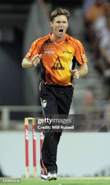 Brad Hogg of the Scorchers celebrates the wicket of Moises Henriques of the Sixers during the T20 Big Bash League Grand Final match between the Perth...
