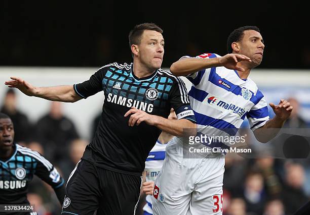 John Terry of Chelsea goes up for a header with Anton Ferdinand of Queens Park Rangers during the FA Cup with Budweiser Fourth Round match between...