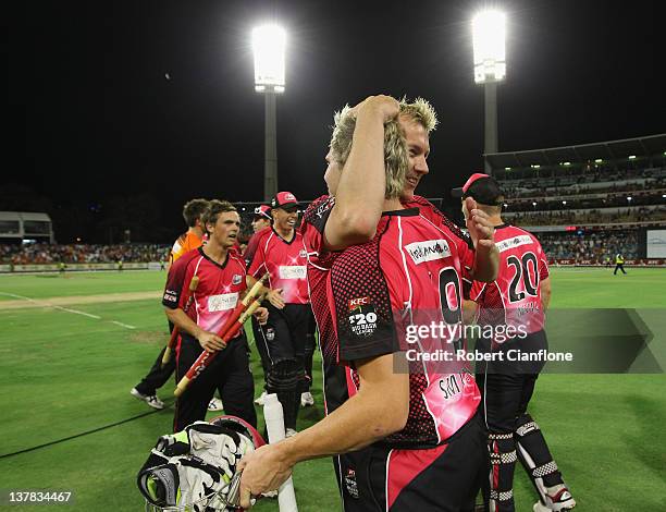 Brett Lee and Steve Smith of the Sixers celebrates after the Sixers defeated the Scorchers at the T20 Big Bash League Grand Final match between the...