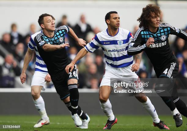 John Terry of Chelsea prepares to defend a cross with Anton Ferdinand of Queens Park Rangers during the FA Cup with Budweiser Fourth Round match...