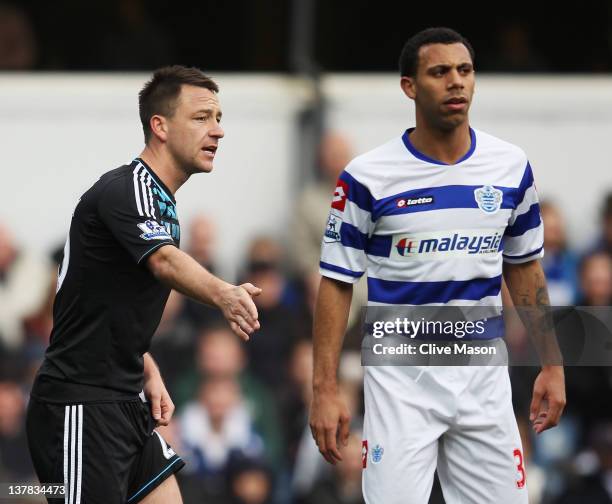 John Terry of Chelsea prepares to defend a corner with Anton Ferdinand of Queens Park Rangers during the FA Cup with Budweiser Fourth Round match...