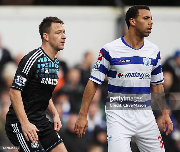 John Terry of Chelsea prepares to defend a corner with Anton Ferdinand of Queens Park Rangers during the FA Cup with Budweiser Fourth Round match...