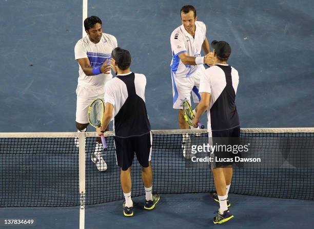 Radek Stepanek of the Czech Republic and Leander Paes of India celebrate championship point after winning their mens' doubles final match against Bob...