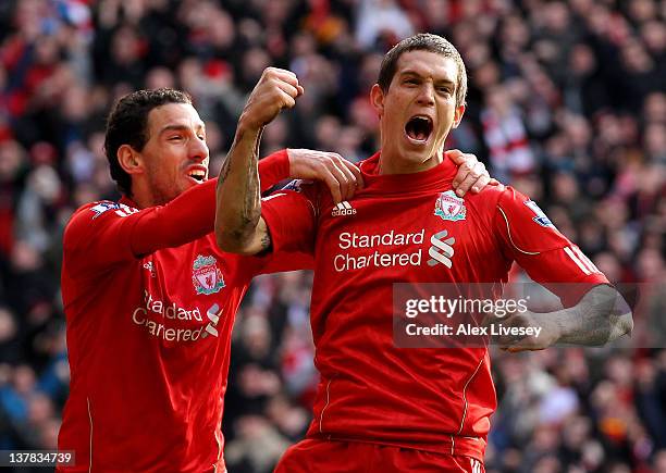 Daniel Agger of Liverpool celebrates scoring the opening goal with Maxi during the FA Cup Fourth Round match between Liverpool and Manchester United...