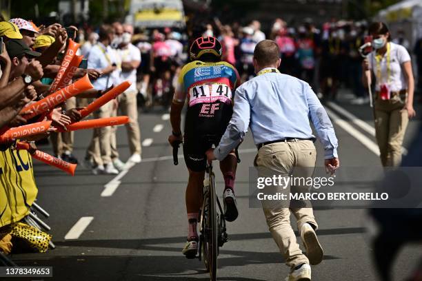 Education - Easypost's Ecuadorian rider Richard Carapaz is assisted after crossing the finish line, having suffered a crash earlier in the stage,...