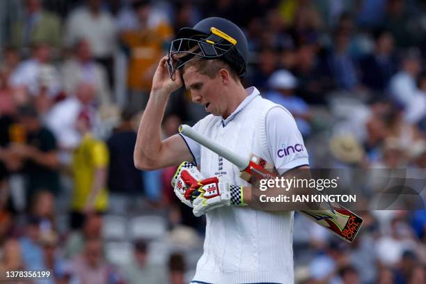 England's Zak Crawley reacts as he walks back to the pavilion after losing his wicket for 3 runs on day four of the second Ashes cricket Test match...